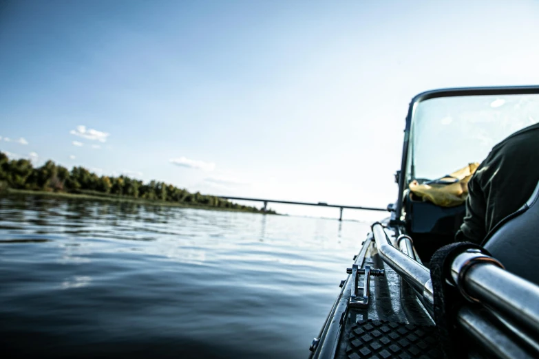 a close up of a boat on a body of water, by karlkka, fishing, guide, wide river and lake, thumbnail