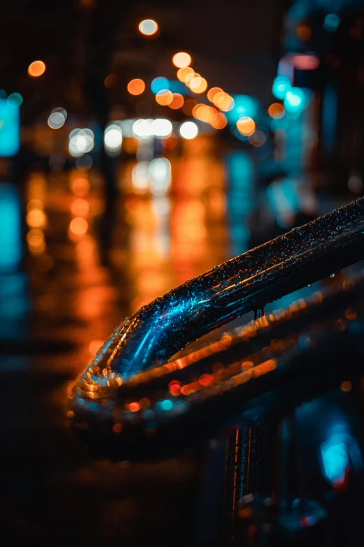 a close up of the handle of a motorcycle, an album cover, by Adam Marczyński, unsplash contest winner, art photography, street lights water refraction, neon rain, orange and blue, today\'s featured photograph 4k