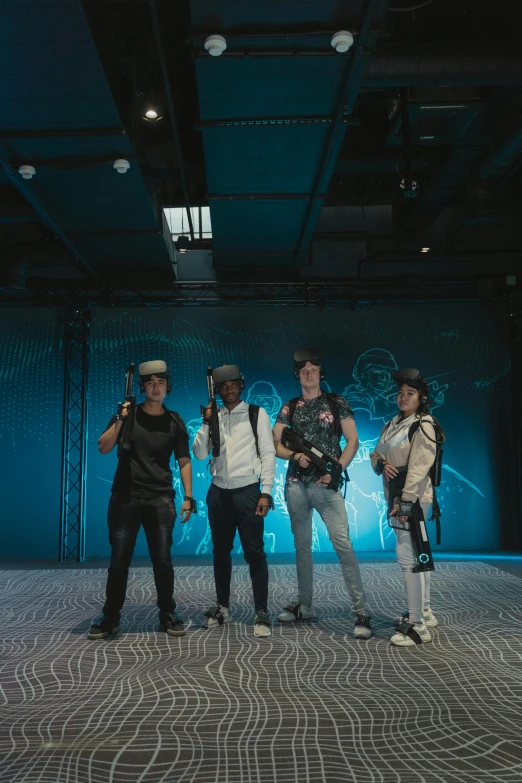 a group of people standing next to each other on a stage, a hologram, graffiti, vr helmet, jetpacks, unreal engine 5 », sport