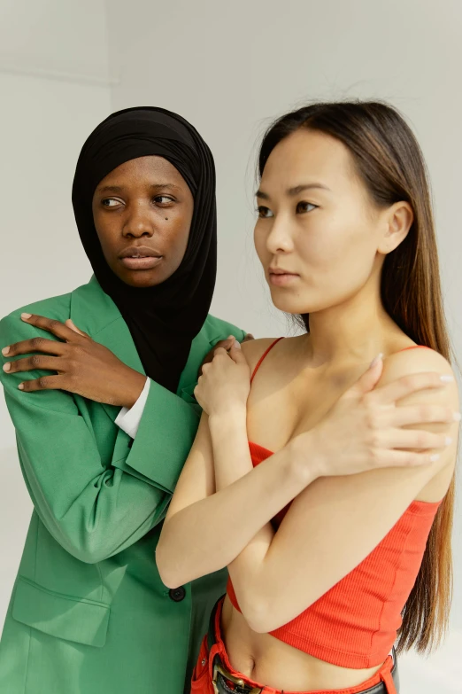 a couple of women standing next to each other, inspired by Ren Hang, trending on pexels, adut akech, islamic, lesbian embrace, asian male