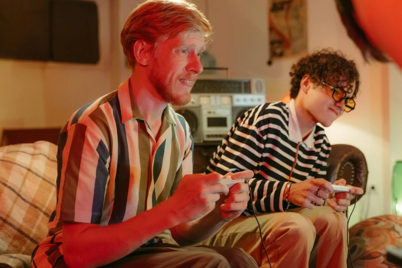 two men sitting on a couch playing a video game, an album cover, brunette boy and redhead boy, h3h3, 4k movie still, youtube thumbnail