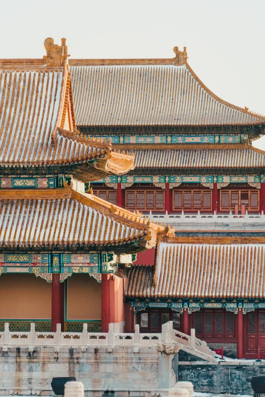 a large building sitting next to a body of water, inspired by Zhang Zeduan, trending on unsplash, cloisonnism, intricate detailed roof, square, hyper - detailed color photo, morning detail