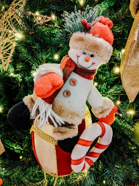 a teddy bear sitting on top of a christmas tree, orange and white, steamboat willy, medium close shot, 🎀 🗡 🍓 🧚