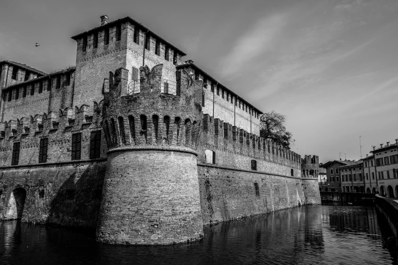 a black and white photo of a castle, by Luca Zontini, pexels contest winner, renaissance, moat, city wall, brown, 1820