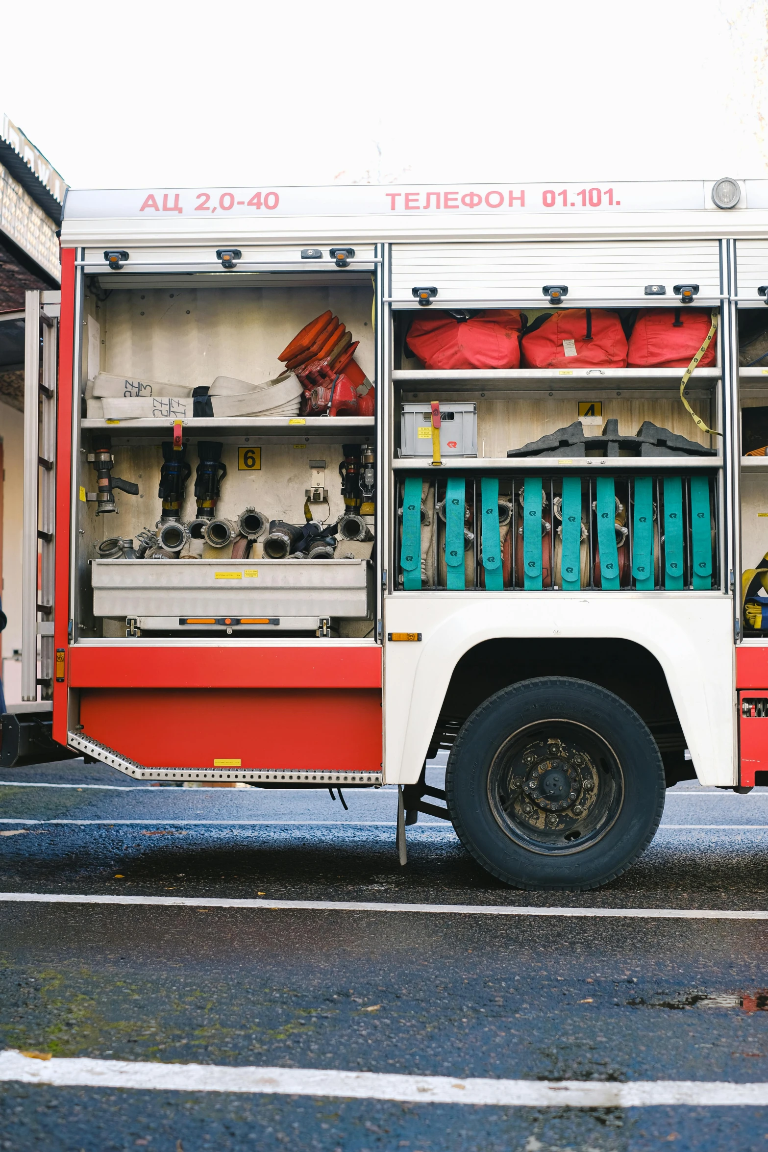 a fire truck parked on the side of the road, pexels contest winner, modernism, square, firefighting gear, low quality photo, caucasian