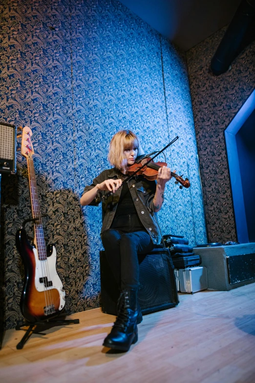 a woman playing a violin in a music studio, an album cover, unsplash, sonic youth, playing guitar onstage, irina nordsol kuzmina, panorama