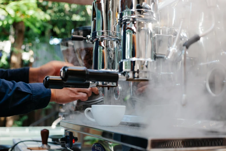 a close up of a person using a coffee machine, al fresco, lots of steam and sparks, award-winning crisp details”, profile image