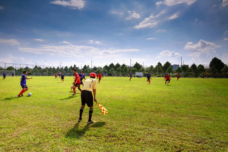 a group of young men playing a game of soccer, by Jan Rustem, pexels contest winner, process art, panoramic, clear sunny day, 15081959 21121991 01012000 4k