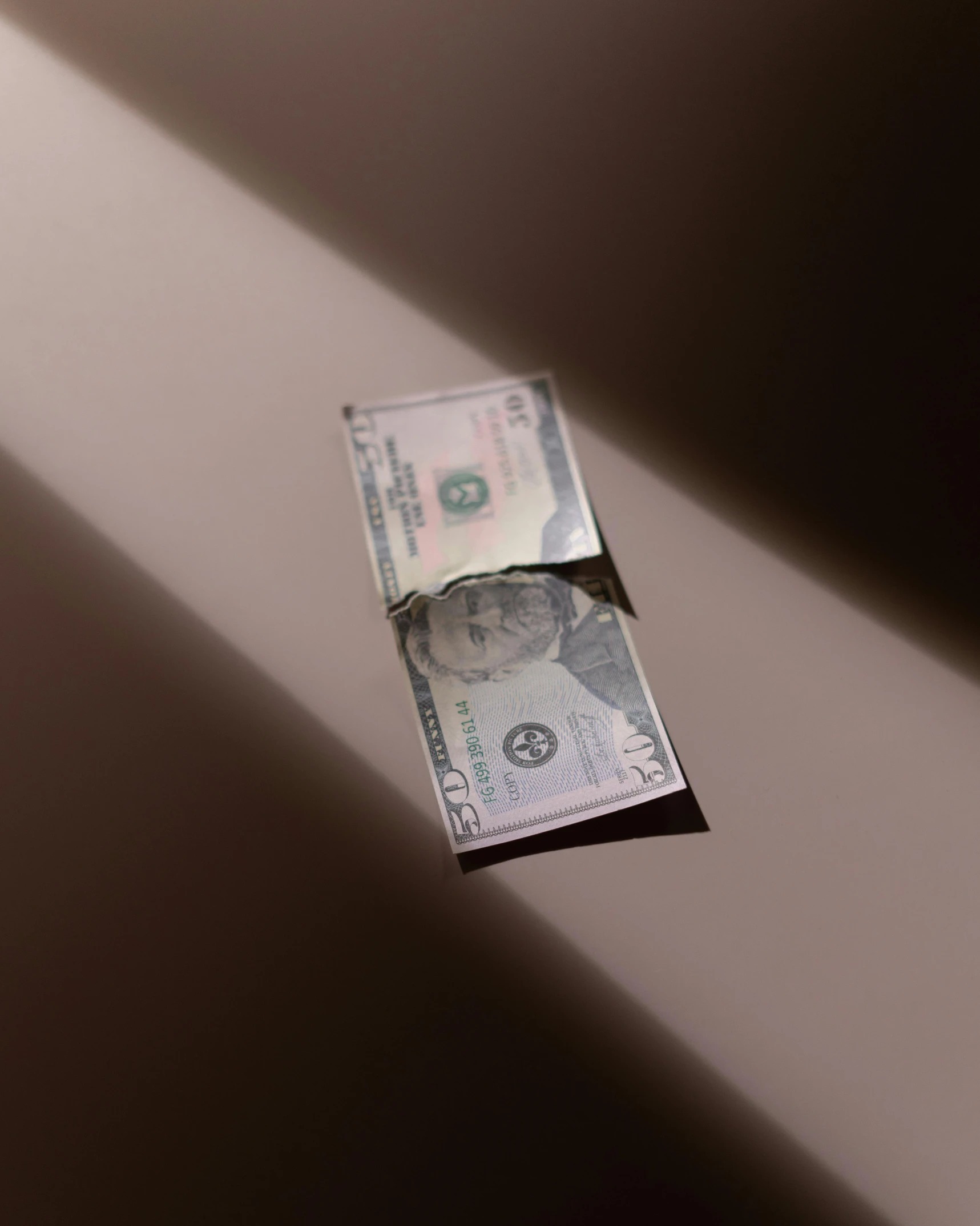 a dollar bill sticking out of a hole in a wall, unsplash, pearlescent skin, thumbnail, lgbtq, slanted lighting from window