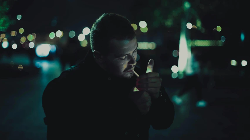 a man smoking a cigarette on a city street at night, an album cover, inspired by Elsa Bleda, pexels contest winner, realism, drinking, holding syringe, film movie still, profile picture 1024px