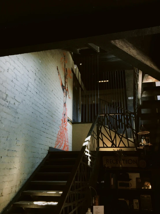 a man riding a skateboard down a flight of stairs, an album cover, by Robbie Trevino, unsplash, graffiti, cozy dark 1920s speakeasy bar, wall mural, view from back, female ascending