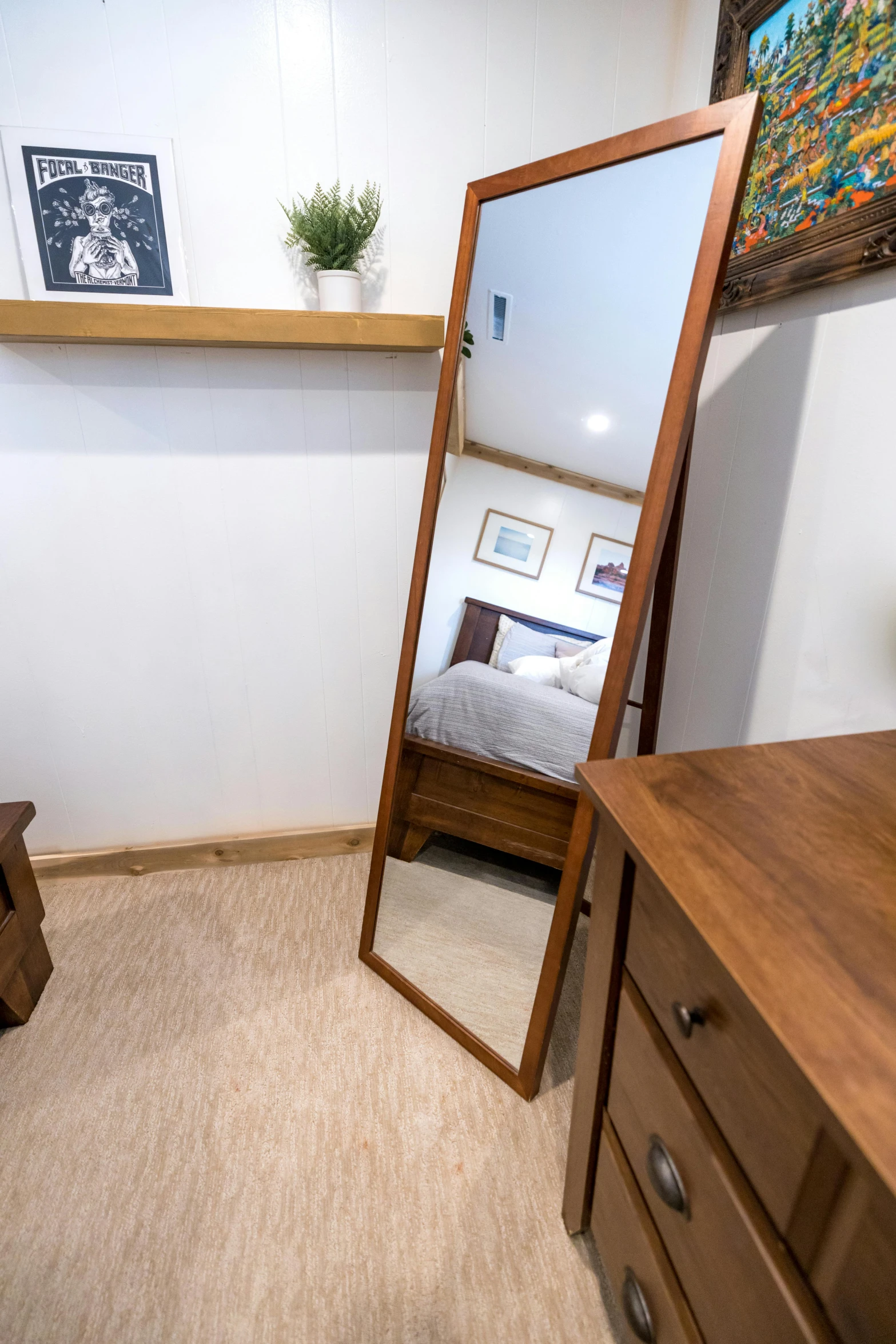 a bed room with a bed a dresser and a mirror, shin hanga, narrow angle, high-angle, rustic, regular build