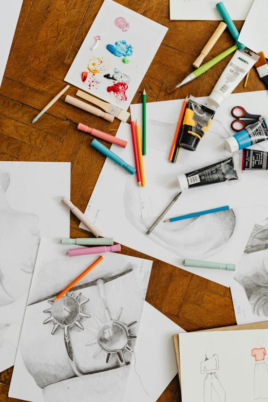 a wooden table topped with lots of different colored pencils, a child's drawing, process art, fashion study, black and white drawing, promo image, illustration and sketch