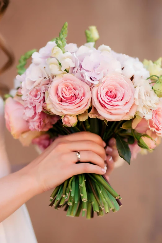 a woman holding a bouquet of pink and white flowers, pearlescent hues, award - winning details, decorative roses, lilacs