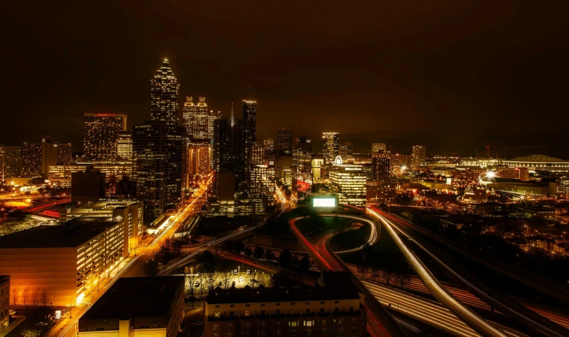 an aerial view of a city at night, by Meredith Dillman, pexels contest winner, hurufiyya, upscale photo, skyline showing, spooky photo, post processed