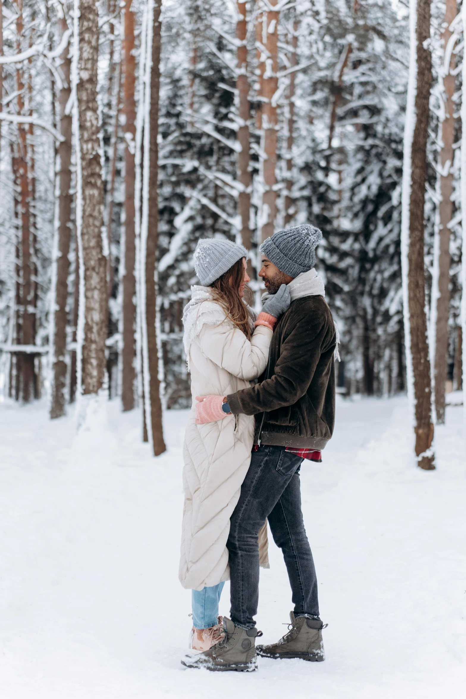 a man and woman standing next to each other in the snow, pexels contest winner, romantic themed, new hampshire, gif, minn