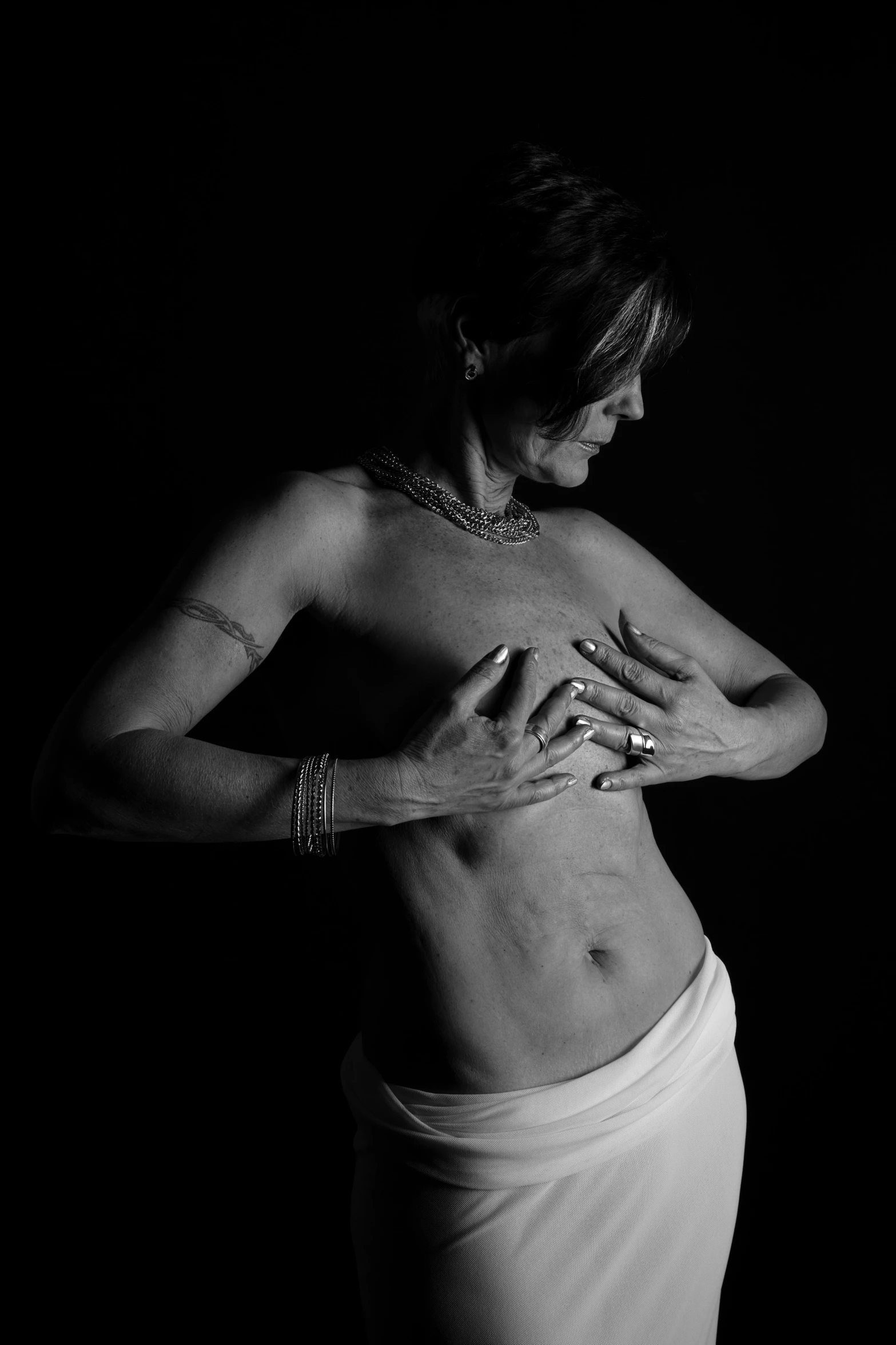 a black and white photo of a woman in a skirt, a black and white photo, inspired by Tracey Emin, sie boob, scars, medical photography, various posed