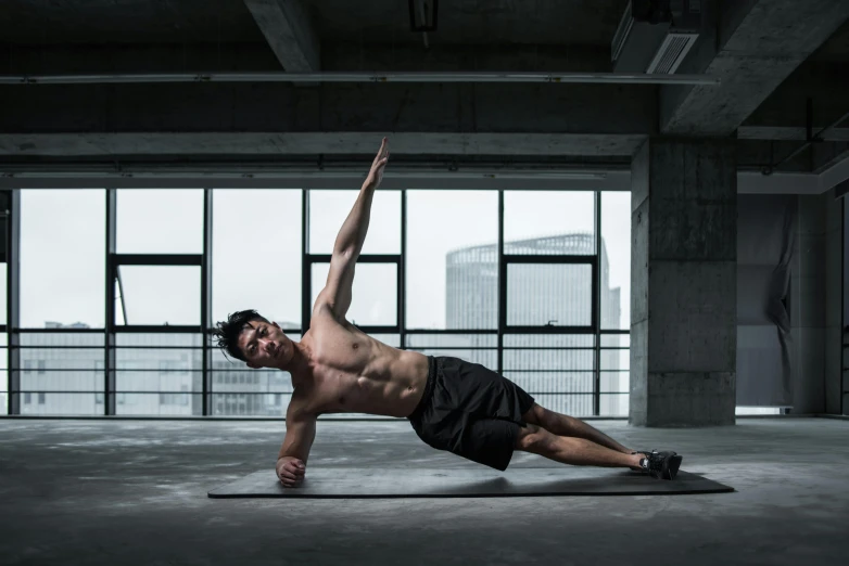 a man doing a push up on a yoga mat, a photo, pexels contest winner, renaissance, male model, thumbnail, ross tan, superman pose