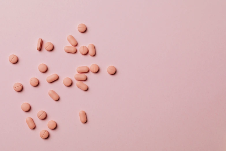 pink pills scattered on a pink surface, by Emma Andijewska, trending on pexels, antipodeans, terracotta, finely illustrated, on grey background, cysts