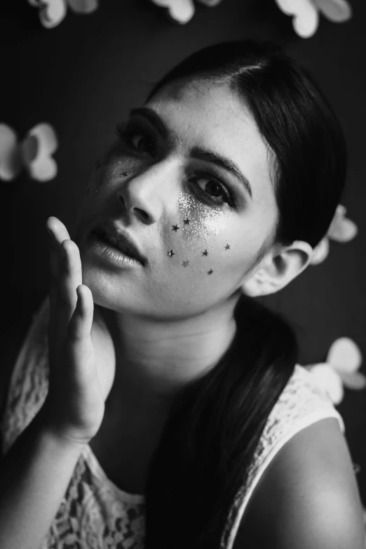 a black and white photo of a woman with freckles on her face, a black and white photo, inspired by irakli nadar, tumblr, with stars, leaky make - up, 🤤 girl portrait, concept photoset