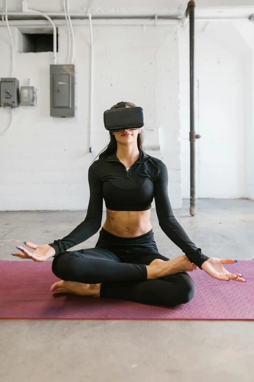 a woman sitting on top of a pink yoga mat, a hologram, unsplash, wearing vr goggles, kali, centered shoulders up view, wearing a vr headset