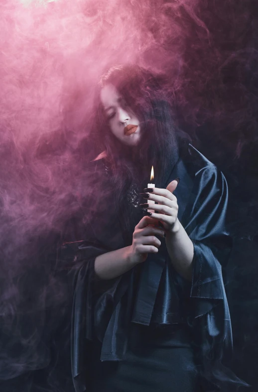a woman in a black dress holding a cigarette, trending on pexels, gothic art, holding a candle, wearing red sorcerers robes, pink smoke, black - haired mage