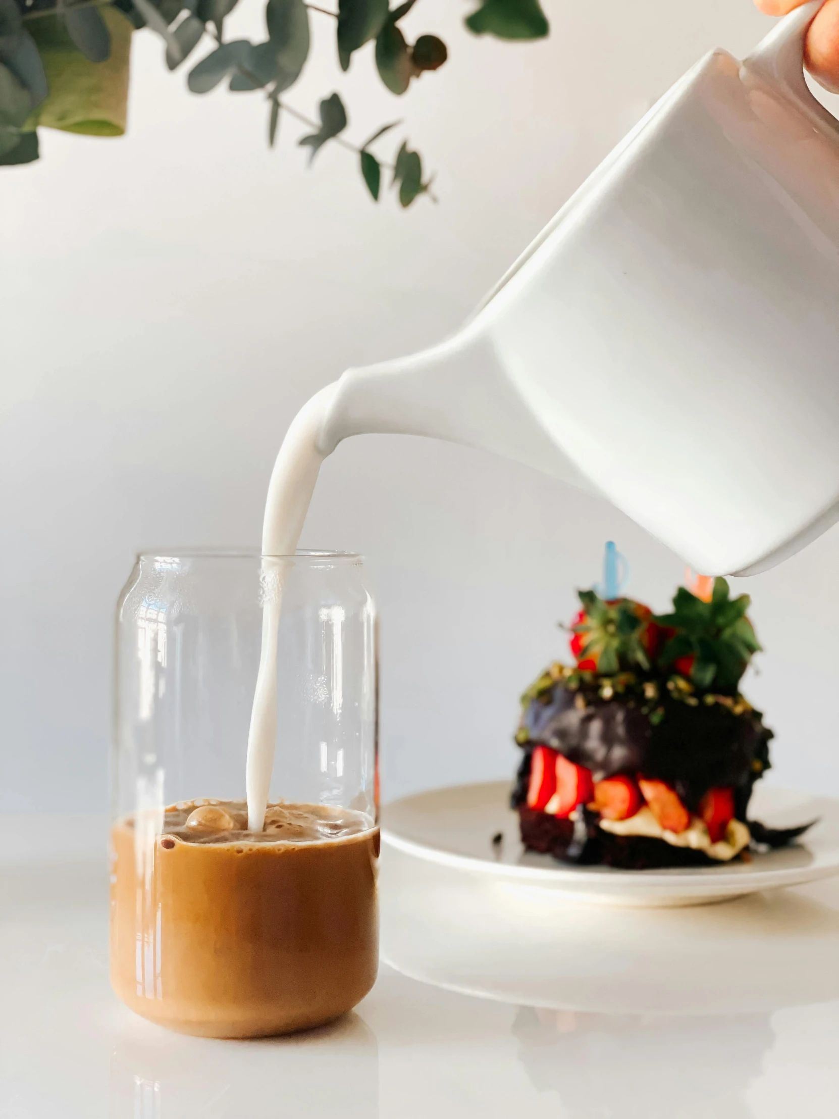 a person pouring milk into a cup on a plate, trending on unsplash, chocolate frosting, aussie baristas, happy birthday, thumbnail