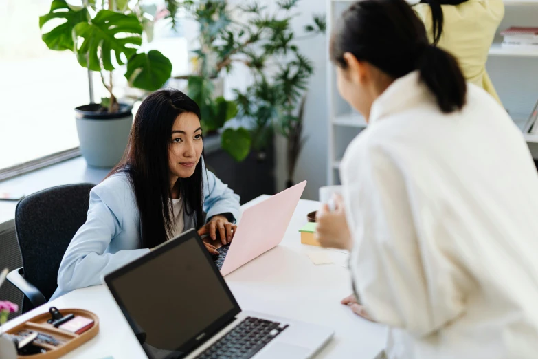 two women sitting at a table with a laptop, trending on pexels, sydney park, avatar image, female in office dress, high quality image