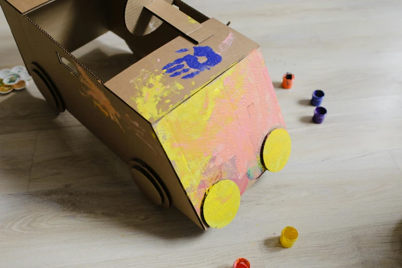 a toy car made out of a cardboard box, inspired by Sam Havadtoy, pexels contest winner, interactive art, finger painting, acid house, diecut, thumbnail