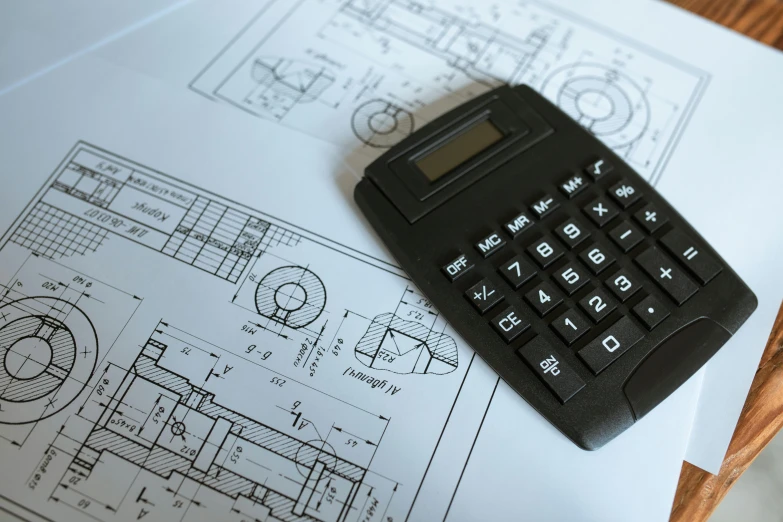 a calculator sitting on top of a piece of paper, a detailed drawing, unsplash, constructivism, orthographic views, engineer, 15081959 21121991 01012000 4k, articulated joints