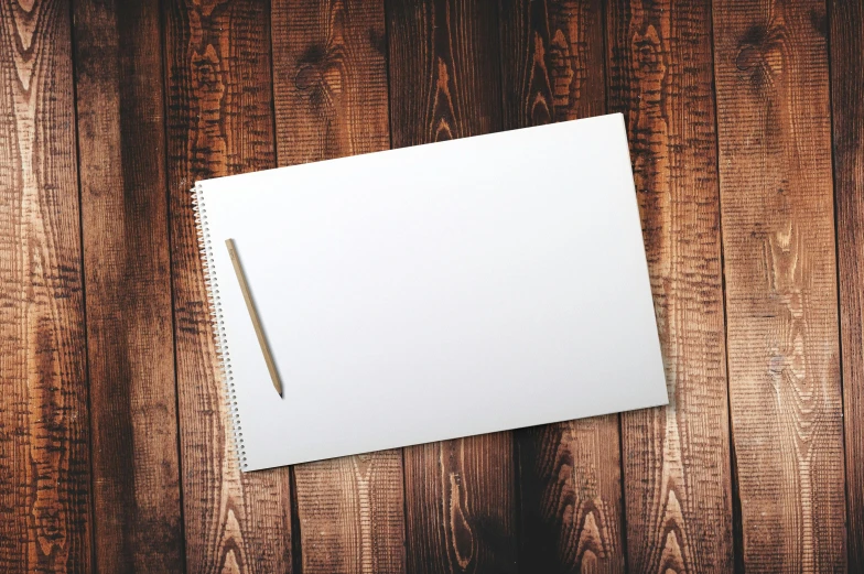 a notepad sitting on top of a wooden table, art canvas, thumbnail, photoshop brush, white paper