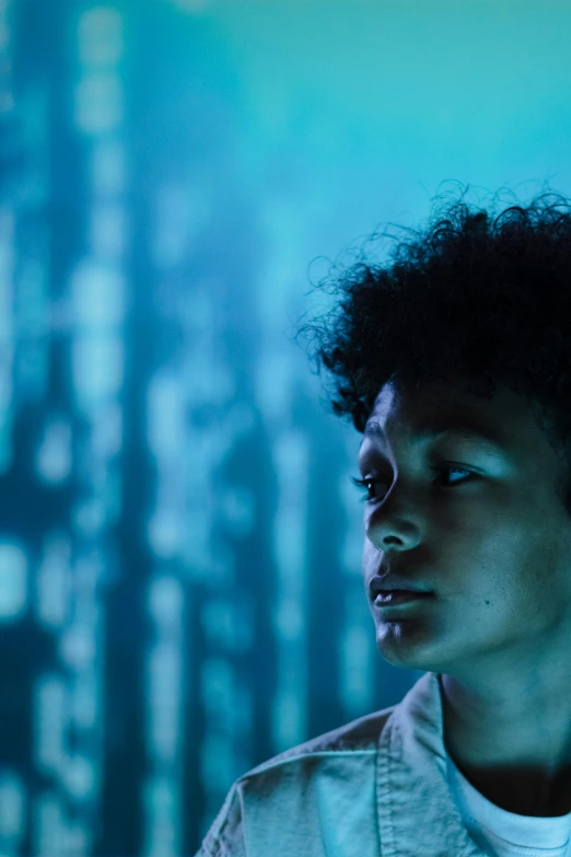 a young man standing in front of a computer screen, afrofuturism, portrait of willow smith, dramatic white and blue lighting, siggraph, movie filmstill