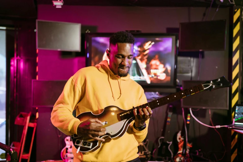 a man that is playing a guitar in a room, mkbhd, playing guitar onstage, warwick saint, immersive