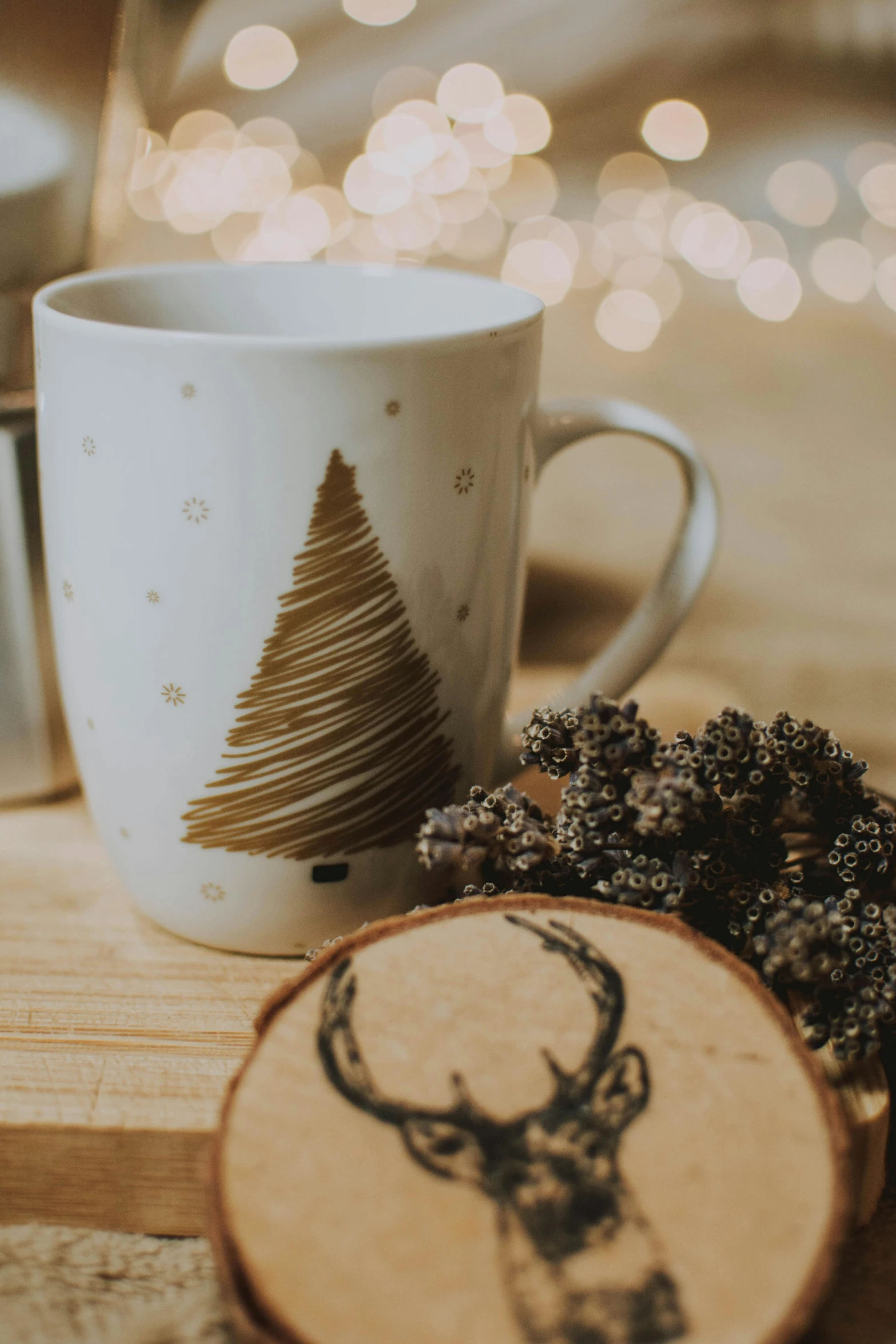 a coffee cup sitting on top of a wooden slice, pexels contest winner, folk art, christmas night, profile image, botanicals, mug shot