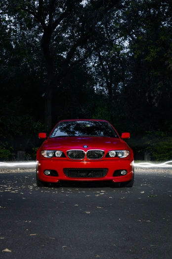a red car parked on the side of the road, pexels contest winner, renaissance, bmw, full frontal lighting, 2010s, round faced