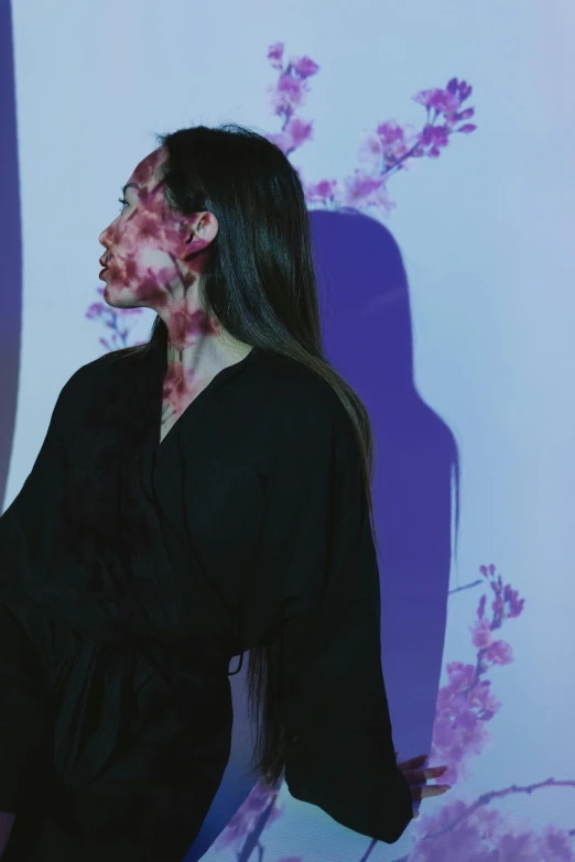 a woman with blood all over her face, an album cover, inspired by Otake Chikuha, pexels contest winner, wearing black and purple robes, teamlab, blossoms, profile pic