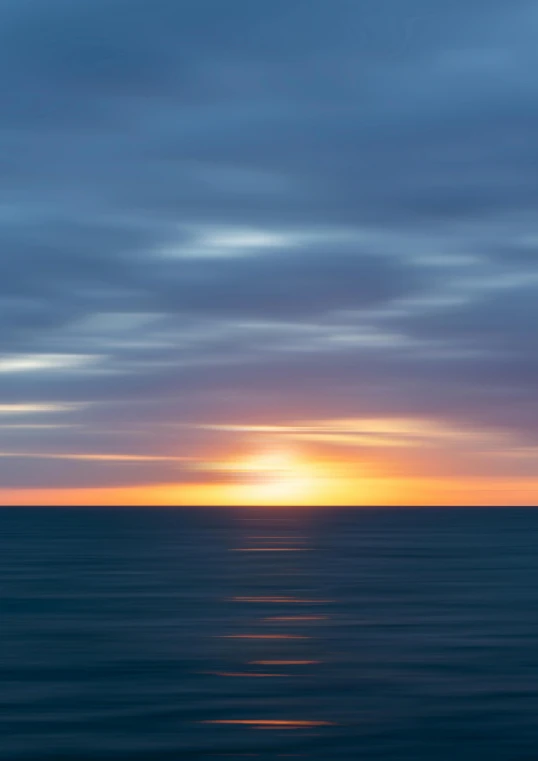 a large body of water under a cloudy sky, a picture, inspired by Jan Rustem, unsplash, minimalism, vibrant sunrise, zoomed out, 2022 photograph, michael wellen