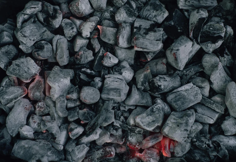 a pile of coal sitting on top of a stove, pexels contest winner, auto-destructive art, 8 k texture, barbecuing chewing gum, panel of black, ((rocks))