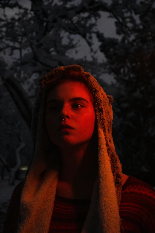 a woman with a towel wrapped around her head, inspired by Elsa Bleda, unsplash, serial art, elle fanning at night, kramskoi 4 k, red cloth around his shoulders, low quality photograph