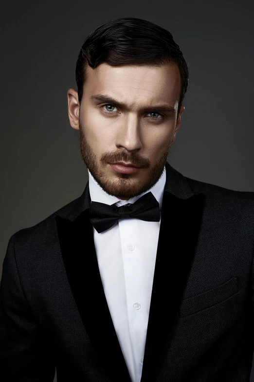 a man in a tuxedo posing for a picture, inspired by Ramon Pichot, shutterstock, square masculine facial features, short stubble, jakub gazmercik, 4k fashion shoot