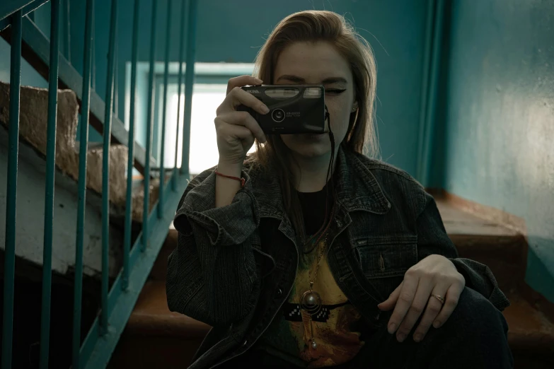 a woman taking a picture of herself with a camera, a polaroid photo, inspired by Elsa Bleda, trending on pexels, graffiti, cyberpunk 2 0 y. o model girl, wearing a dark shirt and jeans, deviantart artstation cgscosiety, sovietwave aesthetic