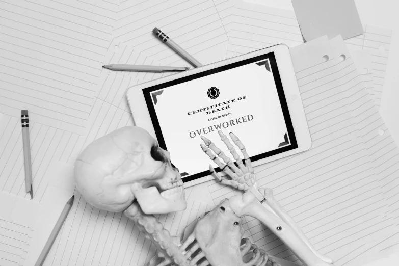 a skeleton sitting next to a tablet computer, shutterstock contest winner, academic art, black and white color aesthetic, worksafe. instagram photo, oscar award winning, holding grimoire