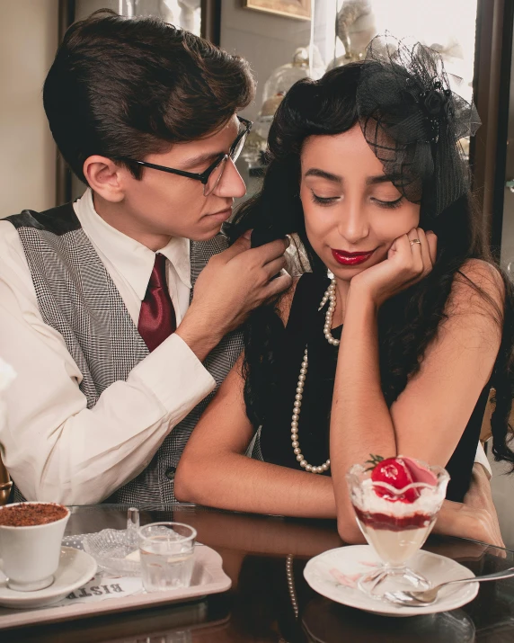 a man and a woman sitting at a table, trending on pexels, art nouveau, dressed like in the 1940s, lesbians, dessert, phone photo