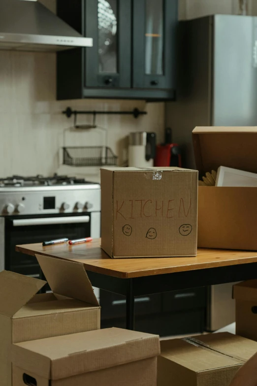 a pile of boxes sitting on top of a kitchen counter, pexels contest winner, inside its box, leaving a room, brown, near kitchen stove