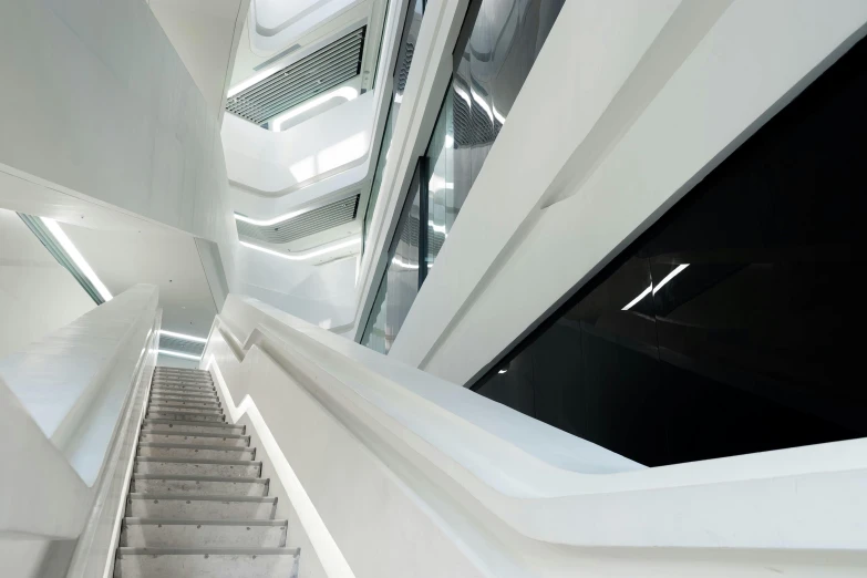 a set of stairs going up to the top of a building, inspired by Zaha Hadid, unsplash contest winner, light and space, white biomechanical details, adjacent hallways, fzd school of design, white walls