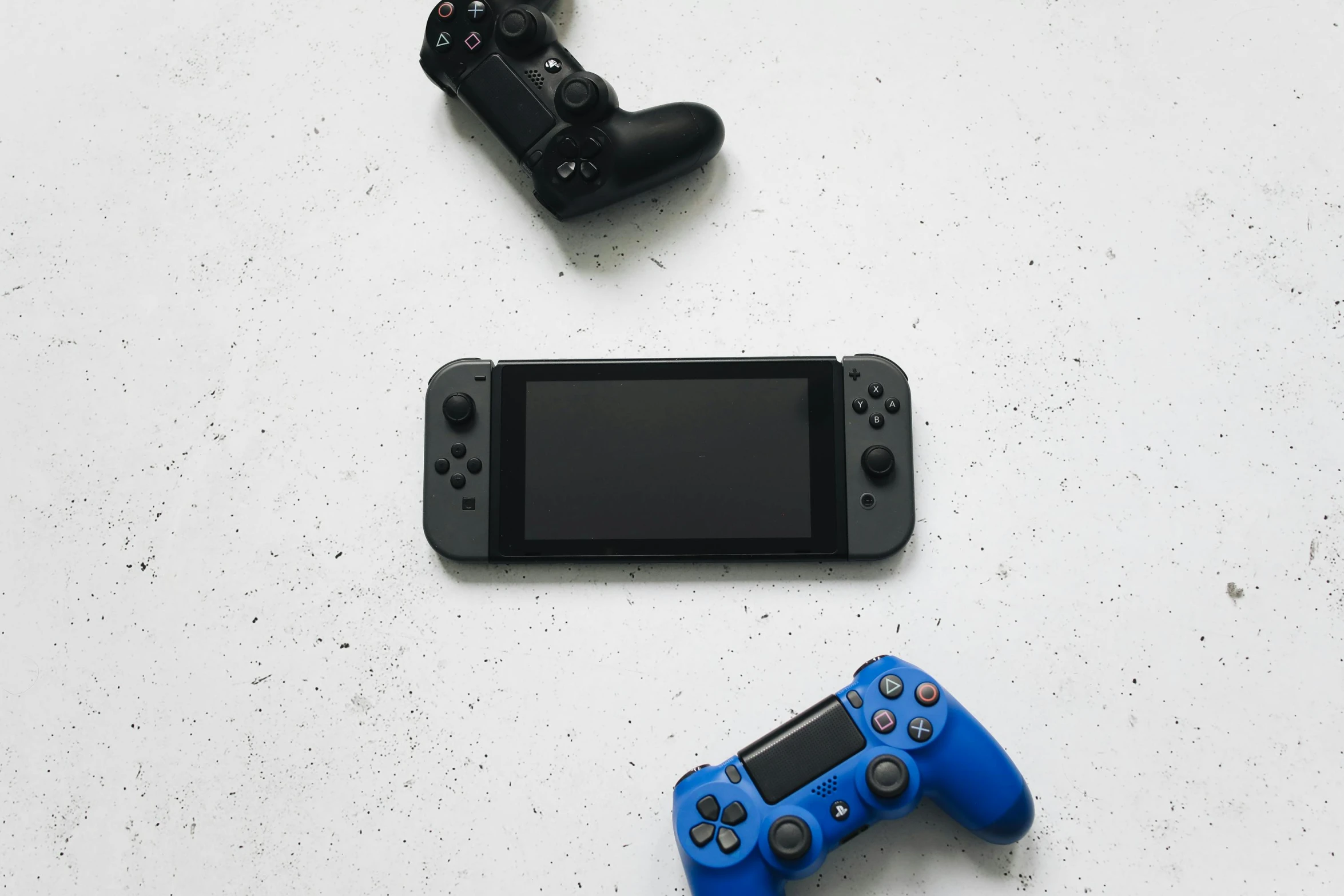 a couple of video game controllers sitting next to each other, a picture, unsplash, minimalism, nintendo switch, blue-black, shot with sony alpha 1 camera, various posed