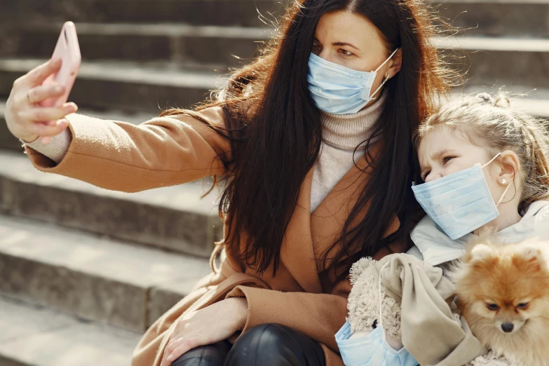 a woman and a little girl wearing face masks, a picture, by Emma Andijewska, trending on pexels, visual art, selfie, brown, multi - layer, 15081959 21121991 01012000 4k