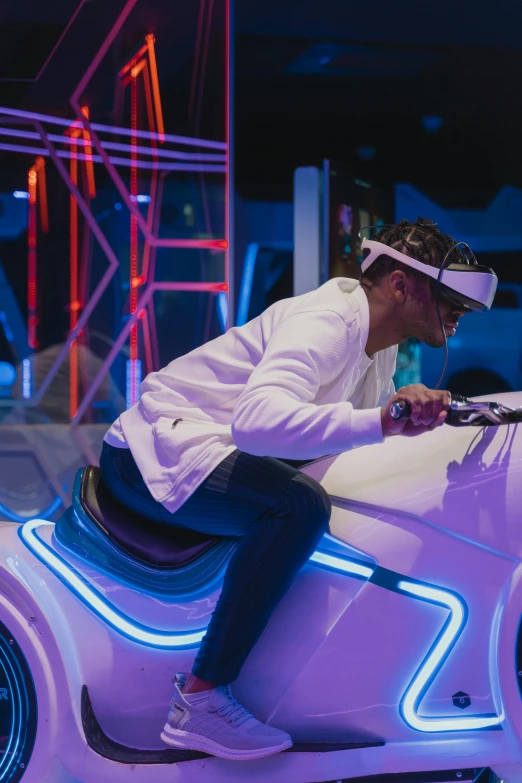 a man sitting on top of a pink car, virtual metaverse room, bumper cars, young thug, glow around helmet