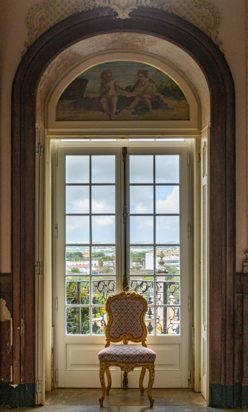 a chair that is sitting in front of a window, rococo, the city of lisbon, expansive view, library of congress, balcony door