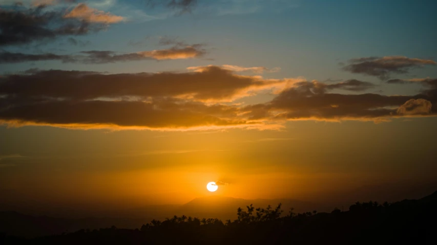 the sun is setting behind the clouds in the sky, pexels contest winner, jamaica, mount, yellow, high quality picture